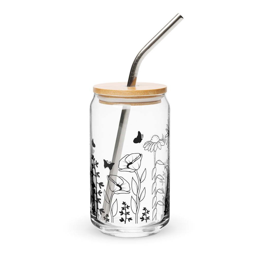 Glass tumbler with bamboo lid and metal straw featuring black floral and butterfly design on a white background