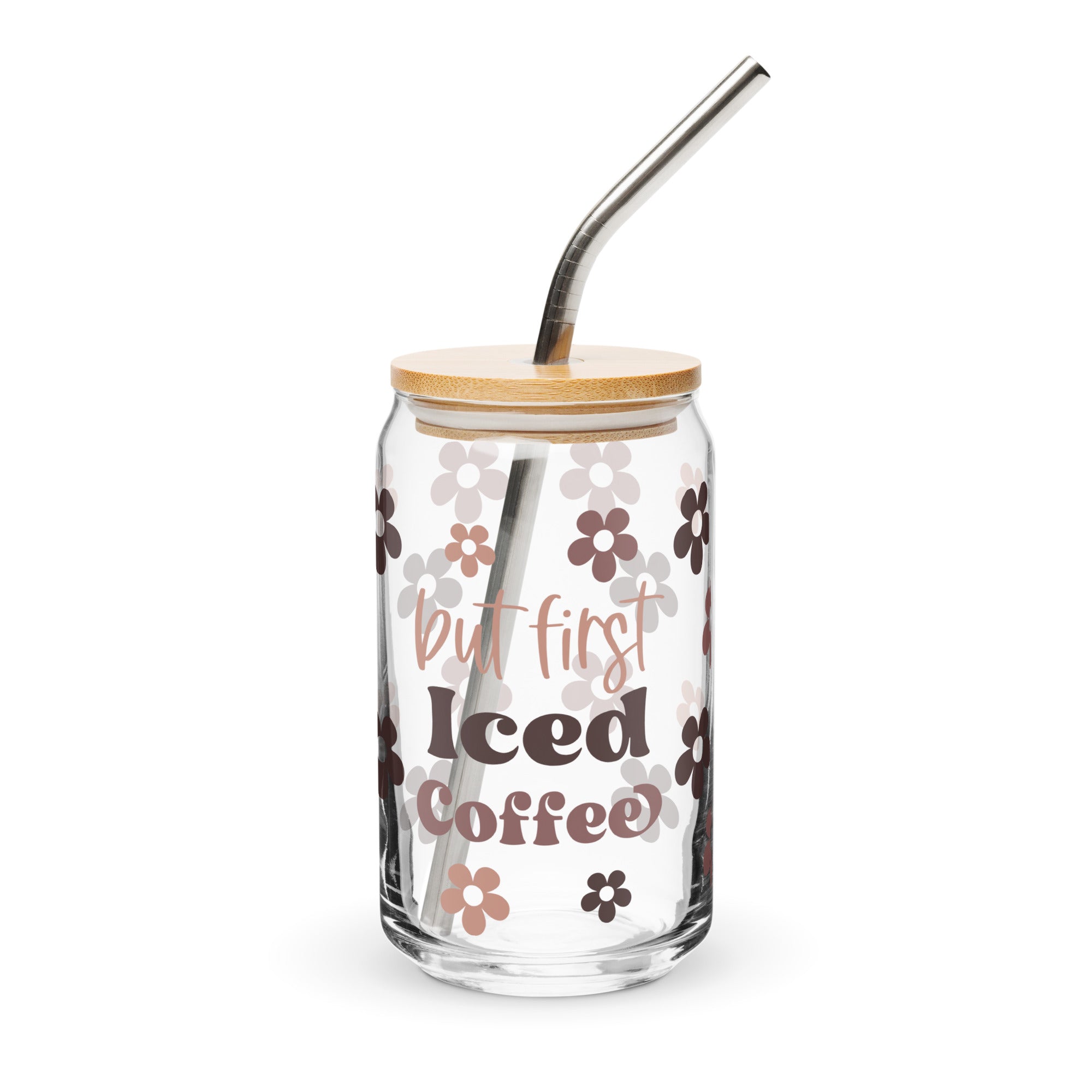 Glass tumbler with floral design and 'but first Iced Coffee' text on a white background