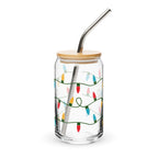 Clear glass tumbler with bamboo lid and metal straw featuring Christmas light design on a white background