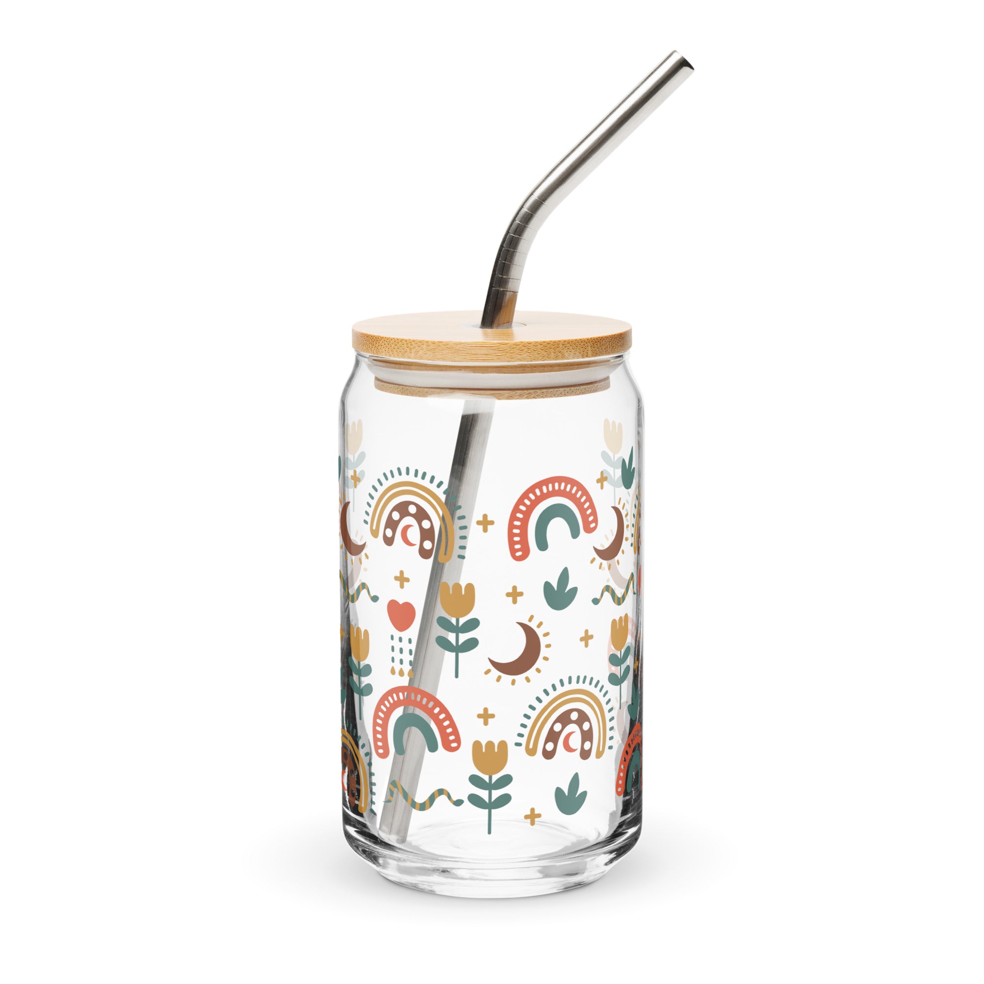 Glass tumbler with a bamboo lid and metal straw featuring colorful patterns on a white background.