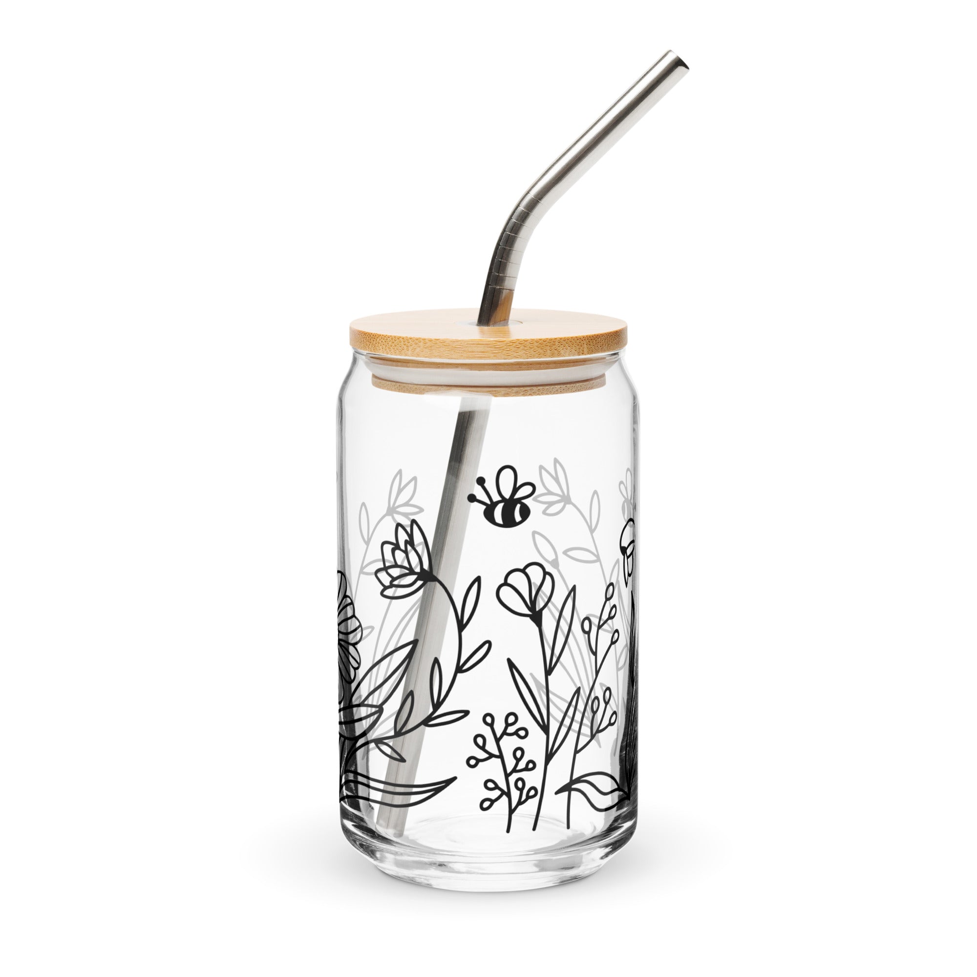 Clear glass tumbler with bamboo lid and metal straw, featuring black line art of flowers and a bee on a white background.
