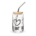 Glass tumbler with bamboo lid and metal straw, featuring heart and love designs on a white background.