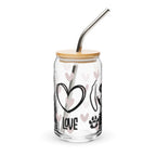 Glass tumbler with bamboo lid and metal straw, featuring heart and paw designs on a white background.