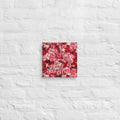 Decorative wall art with floral pattern and text on a textured white wall.