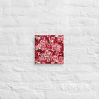 Decorative wall art with floral pattern and text on a textured white wall.