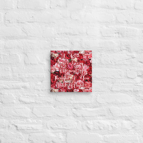 Decorative wall art with floral pattern and text on a textured white wall.