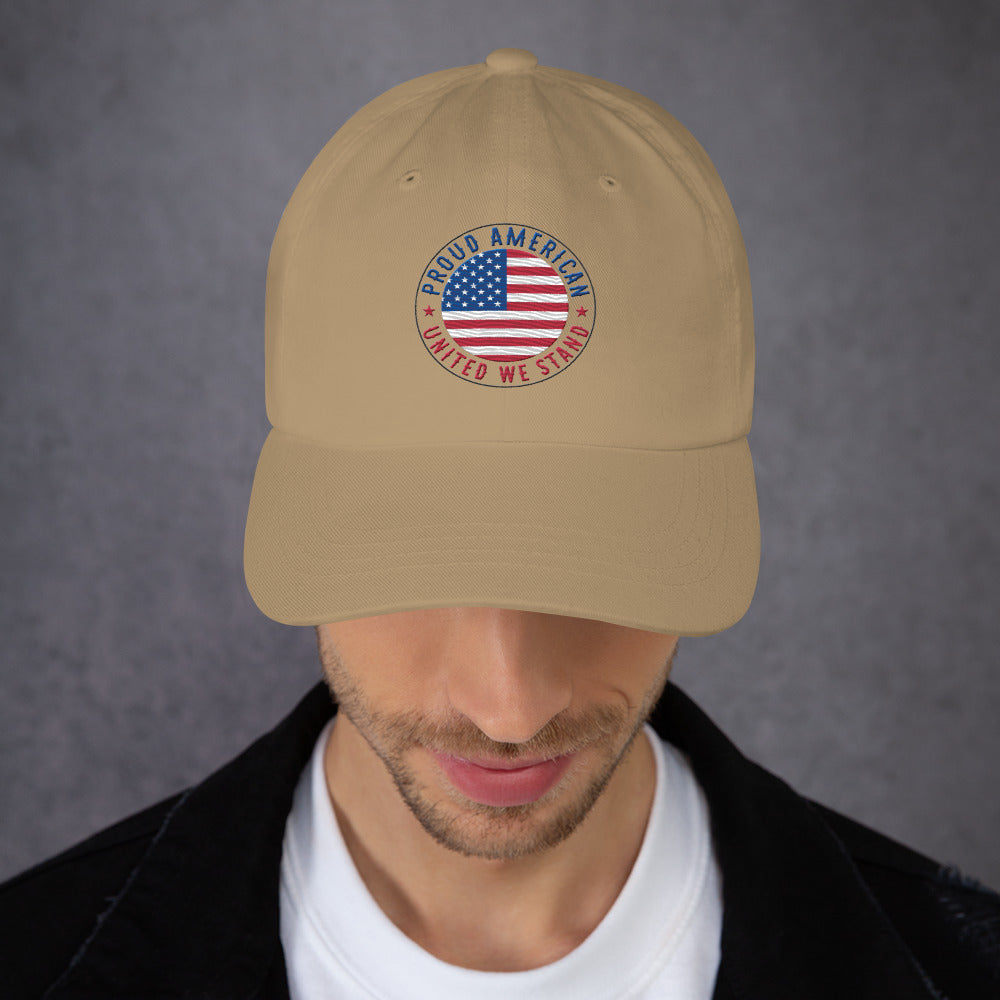 Beige cap with American flag design worn by a person against a gray background