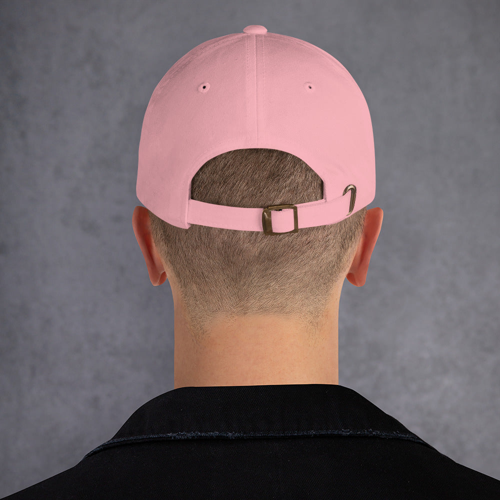 Person wearing a pink cap back with a gray background