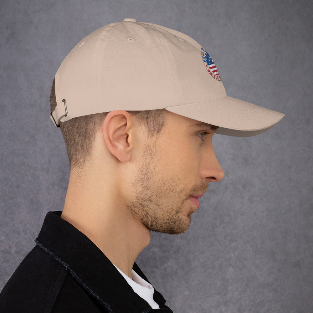 Man wearing a beige cap with a logo on a gray background