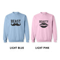 Beast and Beauty matching sweatshirts light blue and light pink
