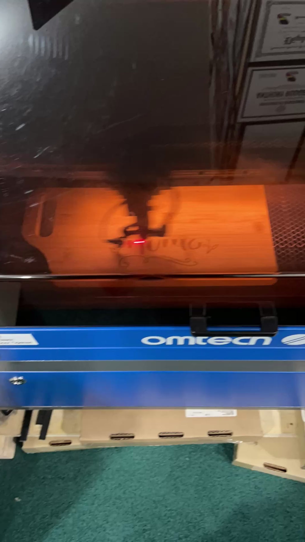 Time-lapsed Video of a cutting board getting laser engraved with "Home Sweet Home" design