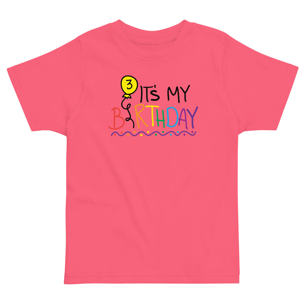 Pink t-shirt with colorful 'It's My Birthday' text and number three design on a white background