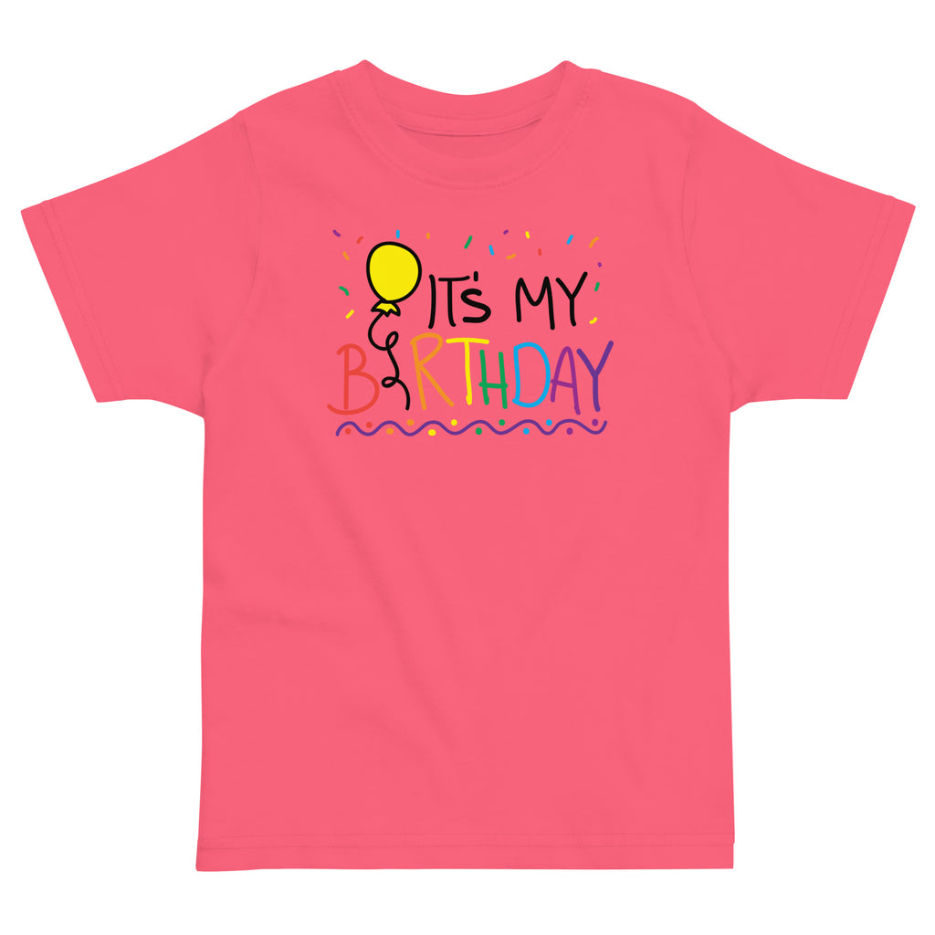 Pink t-shirt with 'It's My Birthday' text and balloon graphic on a white background
