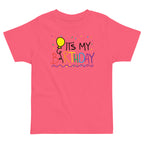 Pink t-shirt with 'It's My Birthday' text and balloon graphic on a white background