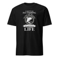 Black t-shirt with white "I Don't Go Fly Fishing To Escape My Life I Go Fly Fishing To Live My Life" text and fish graphic on a white background