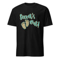 Black t-shirt with 'Secret's Out!' text and footprints on a white background