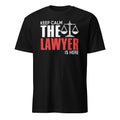 Black t-shirt with 'Keep Calm The Lawyer Is Here' text design on a white background