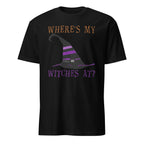 A black short-sleeve crewneck t-shirt featuring a Halloween graphic with the text 'WHERE'S MY WITCHES AT?' in orange and purple, surrounding a black and purple witch hat illustration.