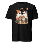 A black short-sleeve crewneck t-shirt featuring a colorful graphic print of two cute cartoon ghosts sitting at a small autumn-themed table with pumpkins, leaves, and bats.
