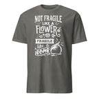Gray t-shirt with white Not Fragile Like A Flower Fragile Like A Bomb text and graphic on a white background