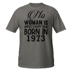 Dark Gray t-shirt with black text 'No woman is perfect except those born in 1973' on a white background