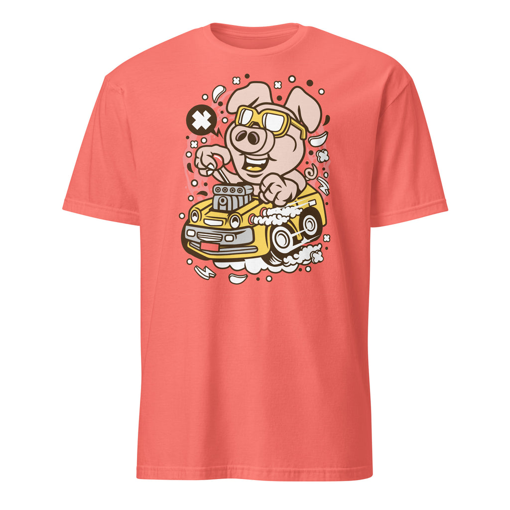 Coral t-shirt with a cartoon pig driving a car graphic on a white background
