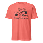Coral t-shirt with "I Like Coffee Because It Gives Me The Illusion I Might Be Awake" text design on a white background