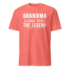 Coral t-shirt with white text 'GRANDMA THE WOMAN THE MYTH THE LEGEND' on a white background
