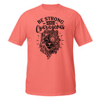 Coral t-shirt with black lion graphic and 'Be Strong and Courageous' text on a white background
