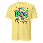 Yellow t-shirt with 'My Dog Walks All Over Me!' text and paw prints on a white background