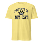 Yellow t-shirt with 'Property of My Cat' text and paw print design on a white background