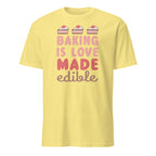 Yellow t-shirt with 'Baking is Love Made Edible' text and cake illustrations on a white background