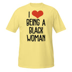Yellow t-shirt with 'I ❤️ BEING A BLACK WOMAN' text on a white background