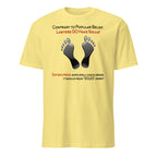 Yellow t-shirt with black footprints and humorous text on a white background