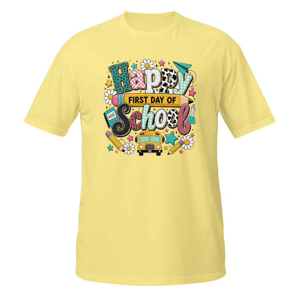 A light yellow short-sleeve t-shirt with a colorful 'Happy First Day of School' graphic on the chest, displayed against a plain white background.