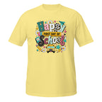 A light yellow short-sleeve t-shirt with a colorful 'Happy First Day of School' graphic on the chest, displayed against a plain white background.