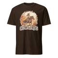 Brown t-shirt with a graphic of a cowgirl on a horse and the text 'Cowgirls' on a white background.