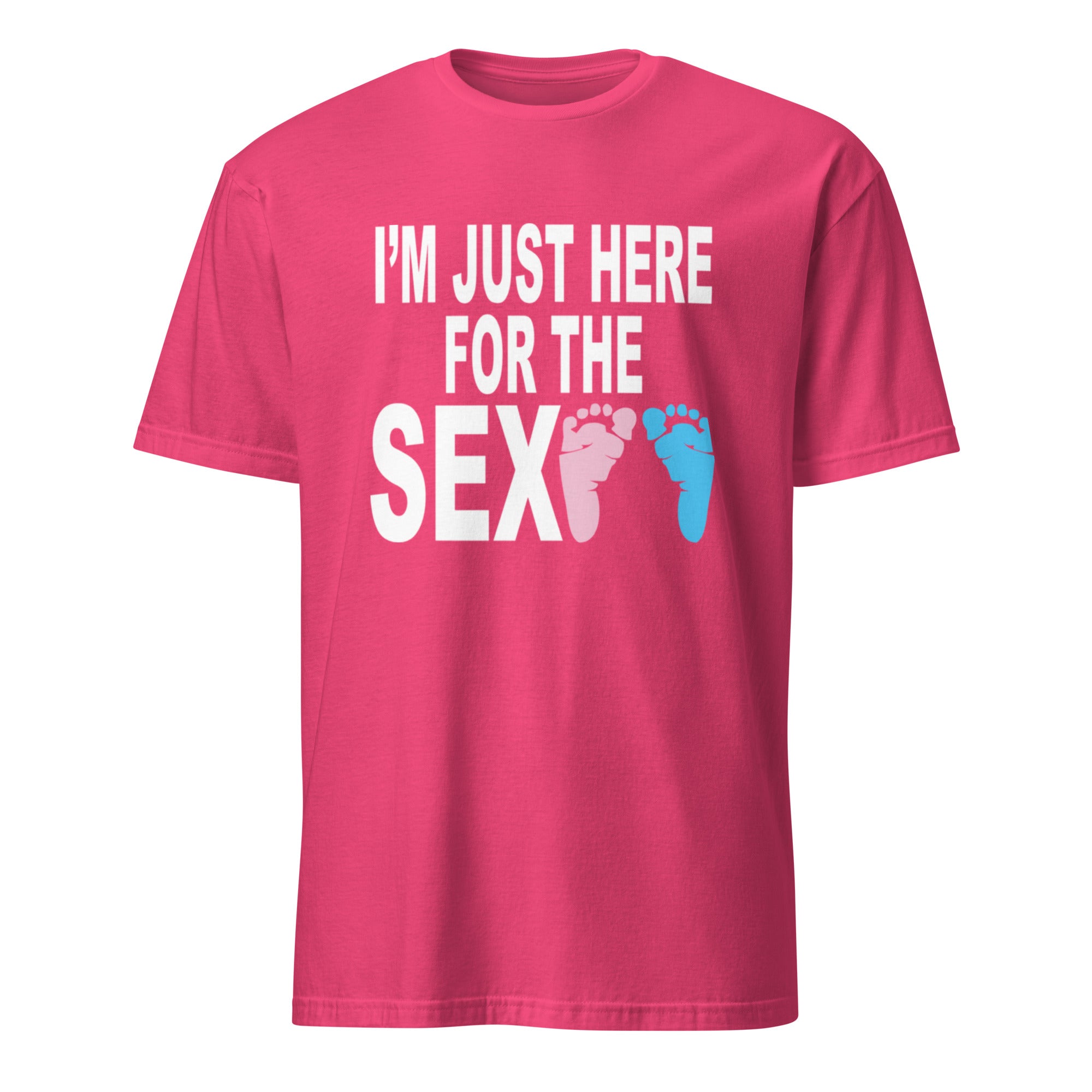 Pink unisex t-shirt with bold black text reading "I'm Just Here for the Sex" displayed flat-lay, styled for a gender reveal party theme with pink and blue accents in the background