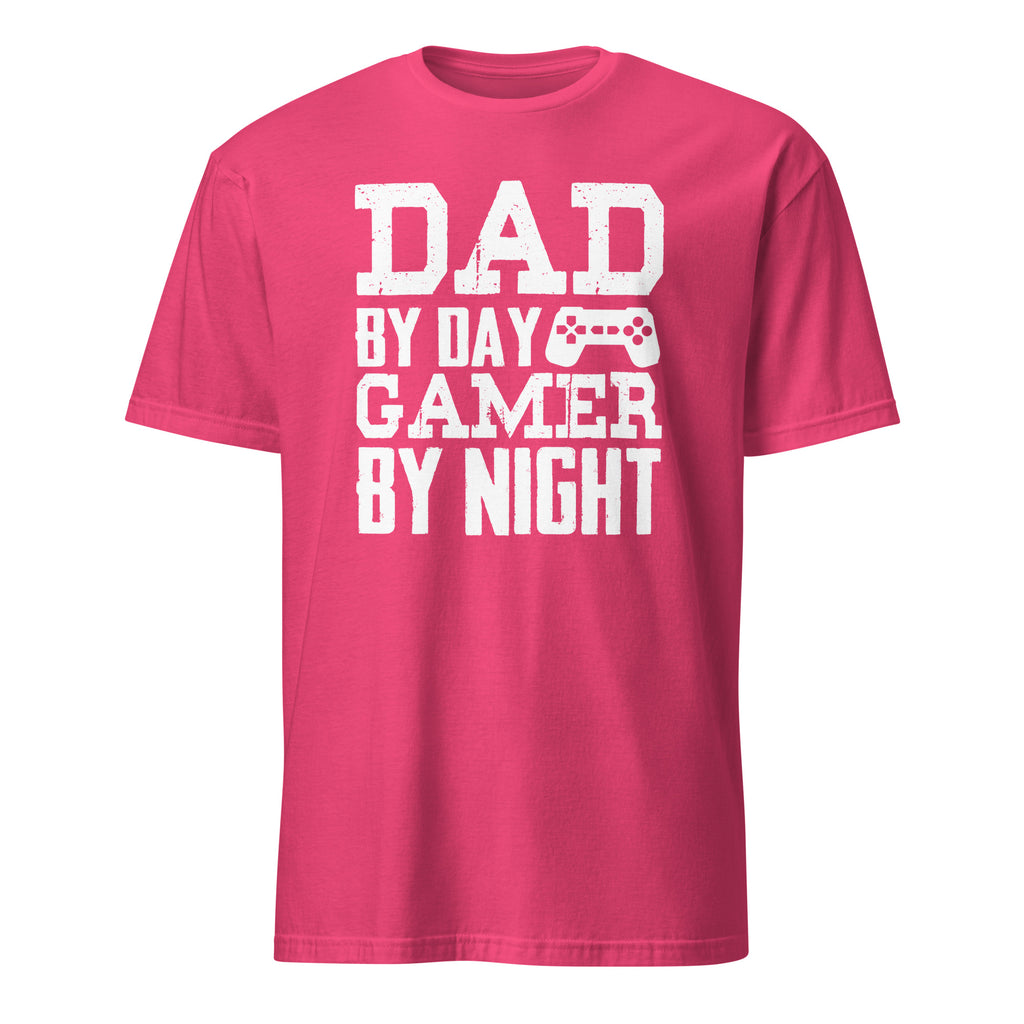 Pink t-shirt with white text 'Dad by day, Gamer by night' on a white background