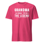 Pink t-shirt with white text 'GRANDMA THE WOMAN - THE MYTH THE LEGEND' on a white background