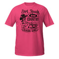 Pink t-shirt with a graphic and text 'Dirt Roads and country Music Kinda Girl' on a white background
