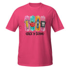 A bright pink short-sleeve t-shirt with a colorful 'Back to School' graphic on the chest, featuring cartoon drawings of a pencil, apple, crayon, and notebook over vertical paint strokes.