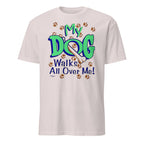 White t-shirt with 'My Dog Walks All Over Me!' text and paw prints on a white background