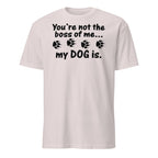 Beige t-shirt with black text and paw prints on a white background