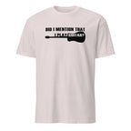 White t-shirt with black text and guitar graphic on a white background