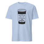 Light blue t-shirt with a coffee cup graphic and "I Never Laugh Until I've Had My Coffee" text on a white background