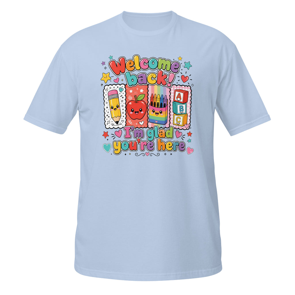 A light blue short-sleeve crewneck t-shirt featuring a colorful 'Welcome Back! I'm glad you're here' school-themed graphic on the chest, displayed against a solid white background.
