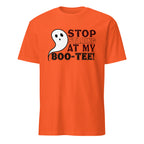 An orange short-sleeve crewneck t-shirt featuring a graphic on the chest with a white cartoon ghost and the text 'STOP STARING AT MY BOO-TEE!' in black and orange lettering, displayed on a solid white background.
