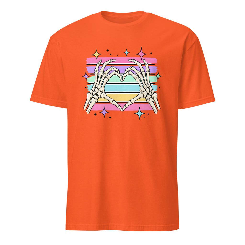 An orange short-sleeve crewneck t-shirt featuring a colorful graphic of skeletal hands forming a heart shape over horizontal pink, purple, blue, and yellow stripes with star accents.