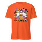 An orange short-sleeve crewneck t-shirt featuring a colorful Halloween graphic on the chest with ghosts, pumpkins, bats, and the text 'BOO CREW'.